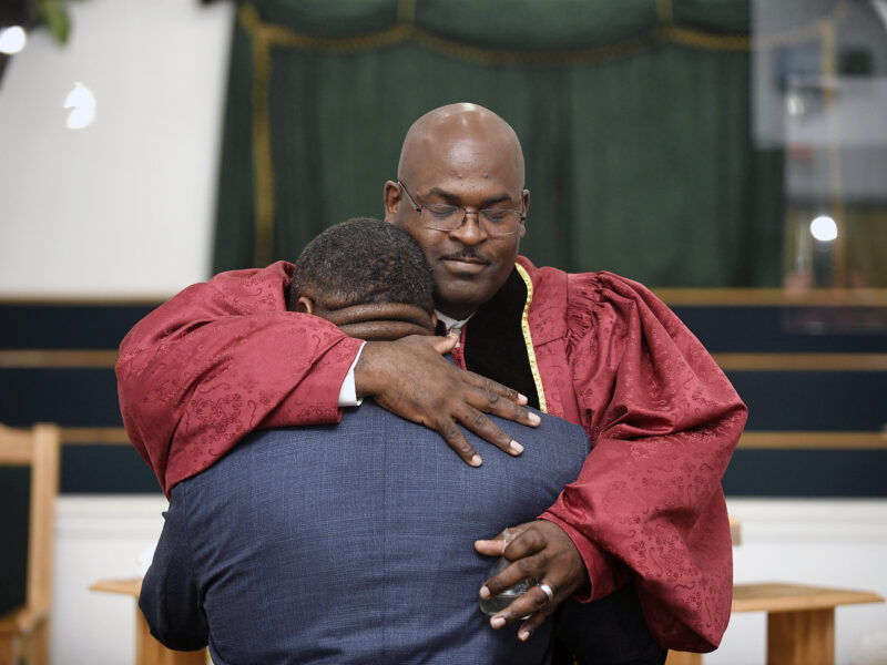 The Reverend Kenneth B. Thomas Sr., pastor of Bethesda Worship and Healing Center in Jonesboro, Arkansas, hugs Cory Brigham after ordaining him into the ministry during Sunday service on August 15, 2021. All photos by Terrance Armstard for The Guardian.