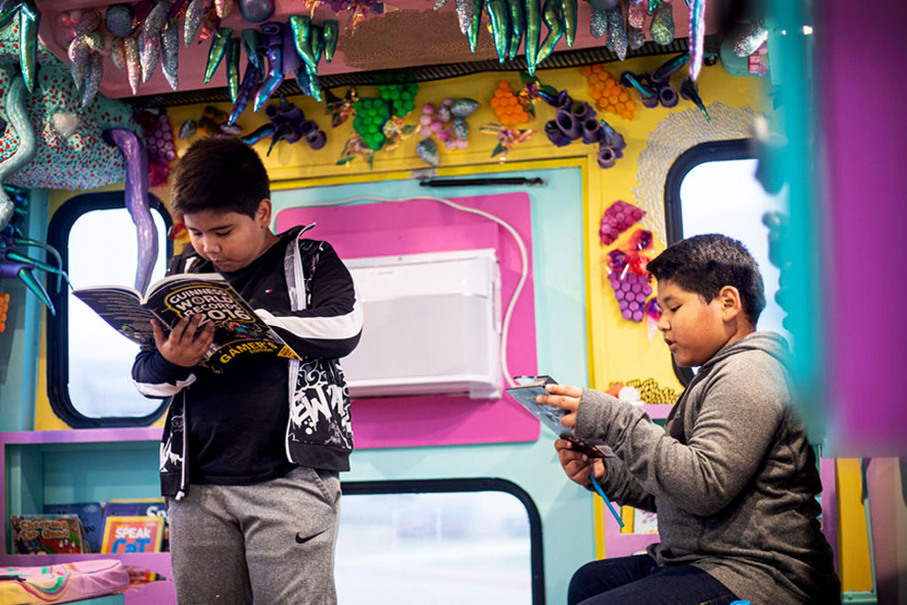 Young readers in the Bat Mobile. Photo courtesy of Austin Bat Cave.
In the state with the most book bans, Texas mobile librarians, booksellers, and bookmobiles are bridging the access gap.