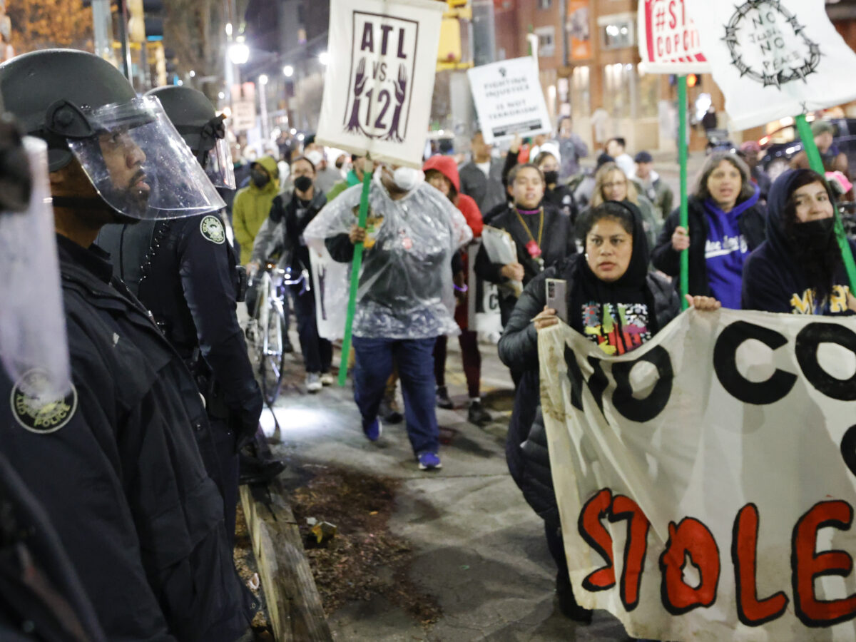 Demonstrators march near Atlanta police during a protest over plans to build a new police training center, Thursday, March 9, 2023, in Atlanta. (AP Photo/Alex Slitz) Cop City protestors now face felony stalking, intimidation, and domestic terrorism charges.