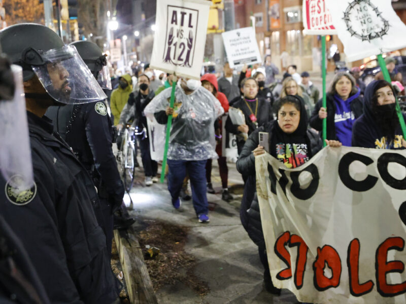 Demonstrators march near Atlanta police during a protest over plans to build a new police training center, Thursday, March 9, 2023, in Atlanta. (AP Photo/Alex Slitz) Cop City protestors now face felony stalking, intimidation, and domestic terrorism charges.