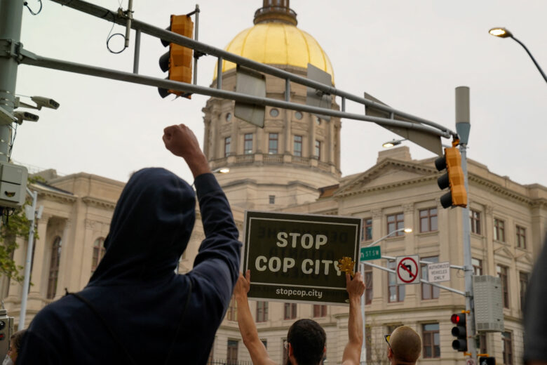 GSU Cop City student demands: Protesters gathered outside of the Georgia State Capitol in Atlanta in protest of Cop City as the clear cutting of trees began on March 31, 2023. REUTERS/Cheney Orr.