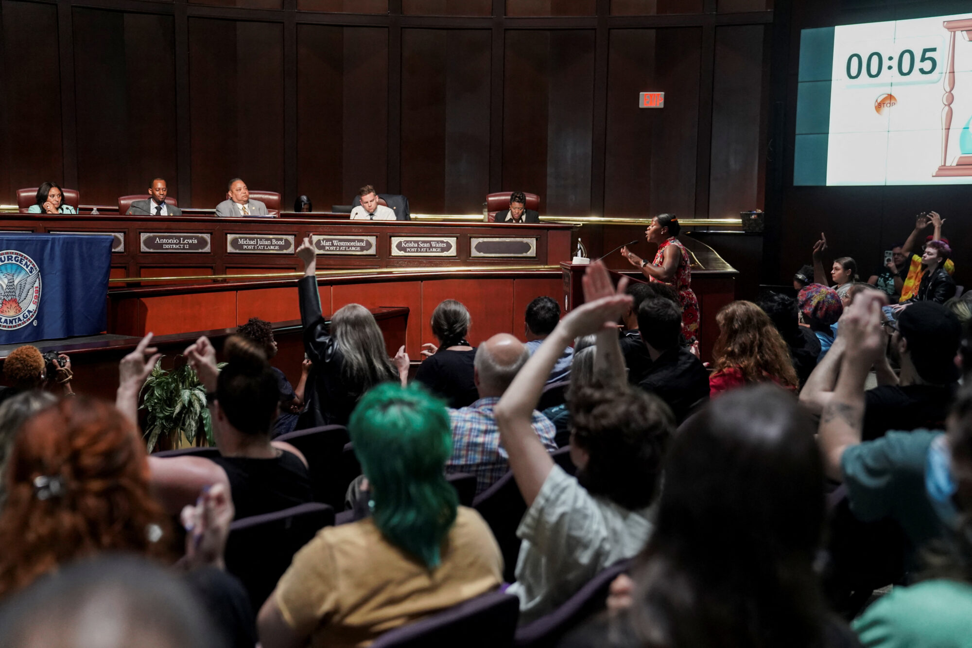 Pack City Hall: Rev. Keyanna Jones speaks while community members attend the city council meeting to protest against the controversial "Cop City" project, inside the city hall in Atlanta on May 15, 2023. REUTERS/Megan Varner.