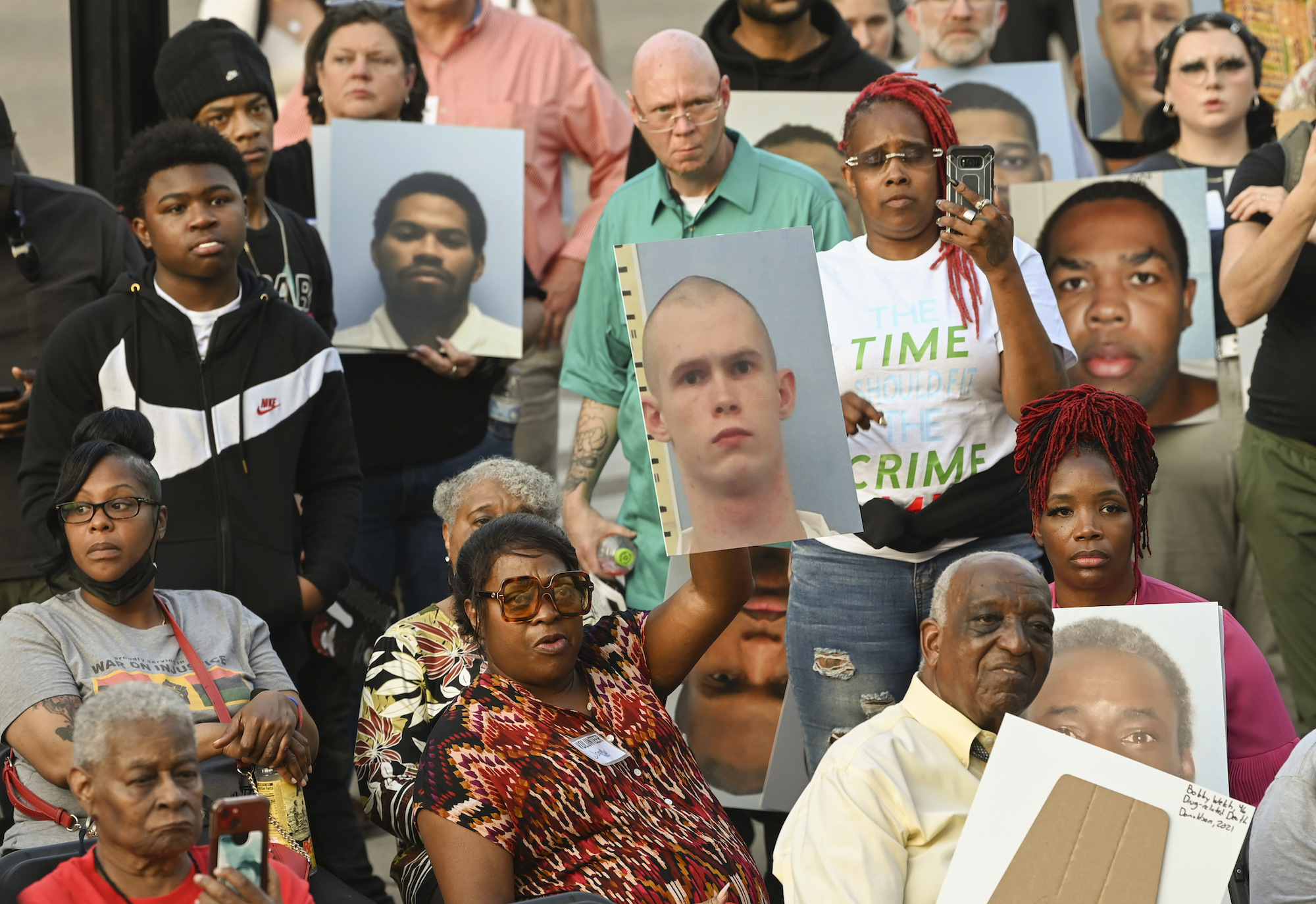 A crowd listens to speakers during the Vigil for the Victims of the Alabama Department of Corrections on March 7, 2023, at Dexter Avenue King Memorial Baptist Church, in Montgomery, Alabama. Family members and concerned citizens remembered nearly 300 people who died in Alabama's prisons this past year. (AP Photo/Julie Bennett)