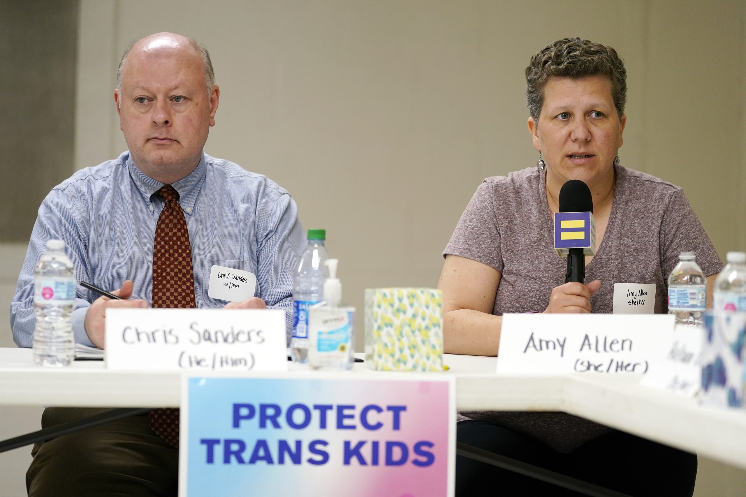 Left, Chris Sanders, Executive Director of the Tennessee Equality Project. Right, Amy Allen, the mother of an eighth grade transgender son, speaks at a Human Rights Campaign roundtable discussion on May 21, 2021 about anti-transgender laws, in Nashville, Tennessee. The roundtable took place in the wake of multiple anti-trans bills winning approval in Tennessee—including one exposing public schools to lawsuits if they let transgender students use multi-person bathrooms or locker rooms that don't reflect their sex at birth. (AP Photo/Mark Humphrey, File)