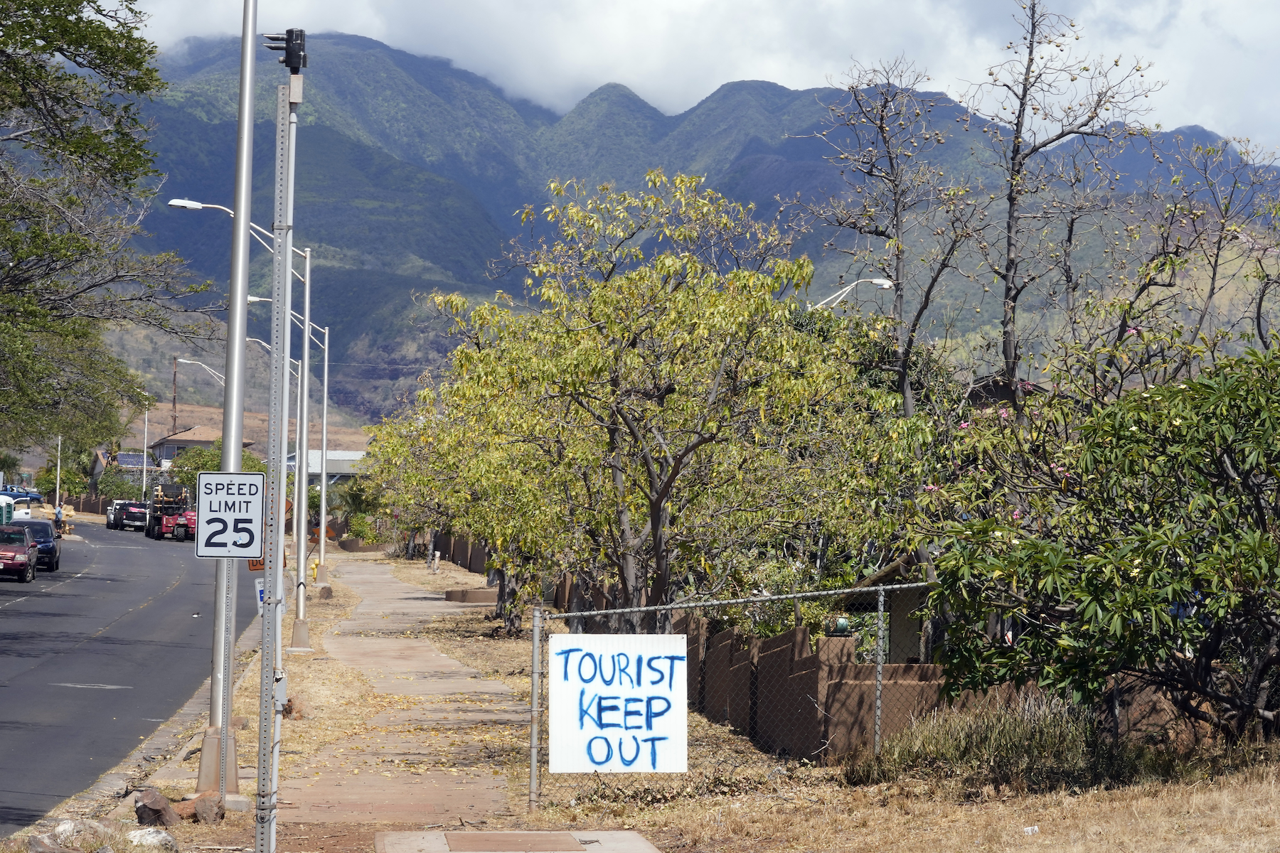 A "Tourist Keep Out" sign is displayed in a neighborhood, Sunday, Aug. 13, 2023, in Lahaina, Hawaii, following a deadly wildfire that caused heavy damage days earlier. (AP Photo/Rick Bowmer)
Insufficient government response to the Maui wildfires follows a pattern of state abandonment forged in the aftermath of Hurricane Katrina.