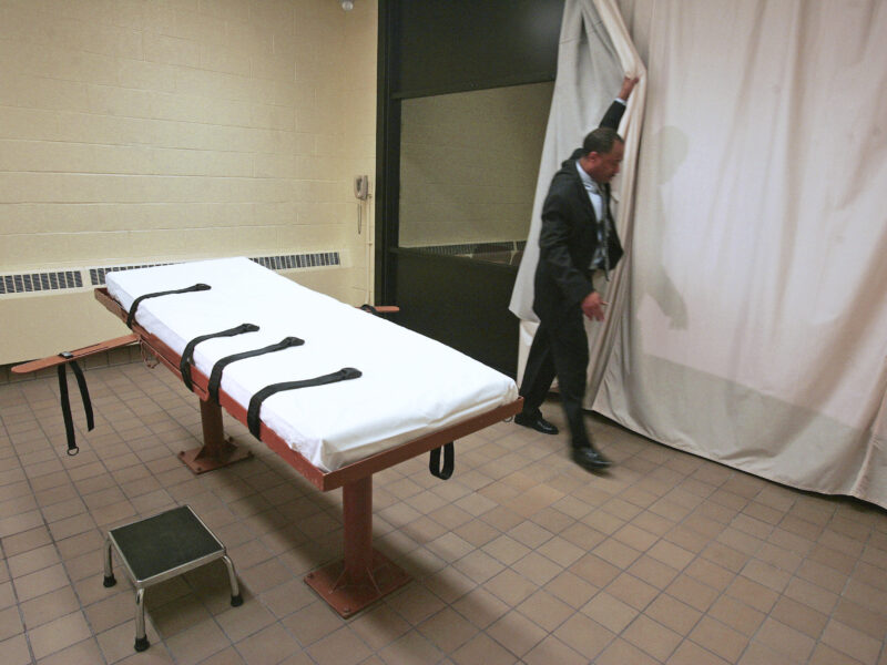In this November 2005 file photo, Larry Greene, public information director of the Southern Ohio Correctional Facility, demonstrates how a curtain is pulled between the death chamber and witness room at the prison in Lucasville, Ohio. (AP Photo/Kiichiro Sato, File) Author Keith LaMar's execution date was moved to 2027 after 30 years on Death Row in Ohio, awaiting the death penalty.