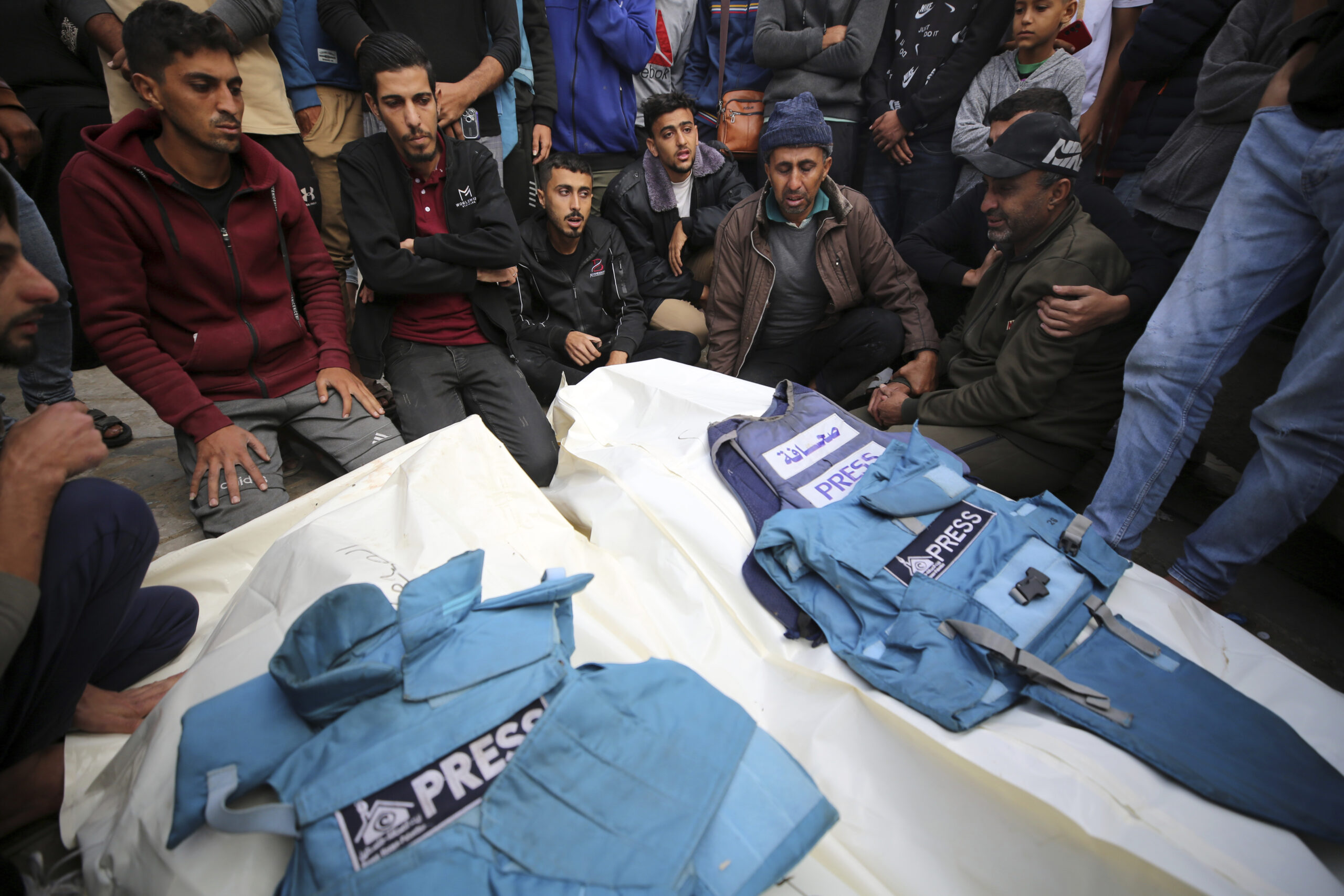 Journalists, relatives and friends pray over the body Journalists Sari Mansour and Hassouna Esleem after they were killed When a house was hit in the Israeli bombardment they were inside it of Bureij camp in the central Gaza Strip on November 19, 2023. (Photo by Majdi Fathi/NurPhoto via AP)